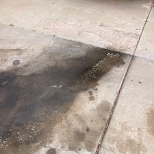 Heavy-Diesel-engine-oil-stains-removed-from-concrete-driveway-in-Prescott-Valley-Arizona-using-environmentally-safe-cleaner-with-hot-water-pressure-washer 1