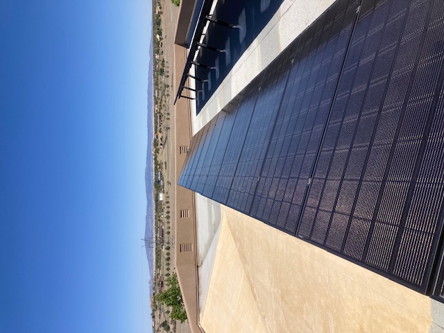 Top quality cleaning of 32 solar panel cleaning of paint overspray mounted on a flat roof in Prescott Williamson Valley Arizona using special paint remover safe for solar panel and DI water
